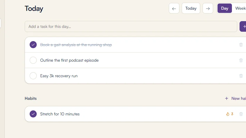 The planner's day view: today's tasks with one ticked off, and a habit with its live streak.